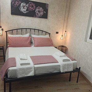 1 bedroom, desk, iron/ironing board, travel crib