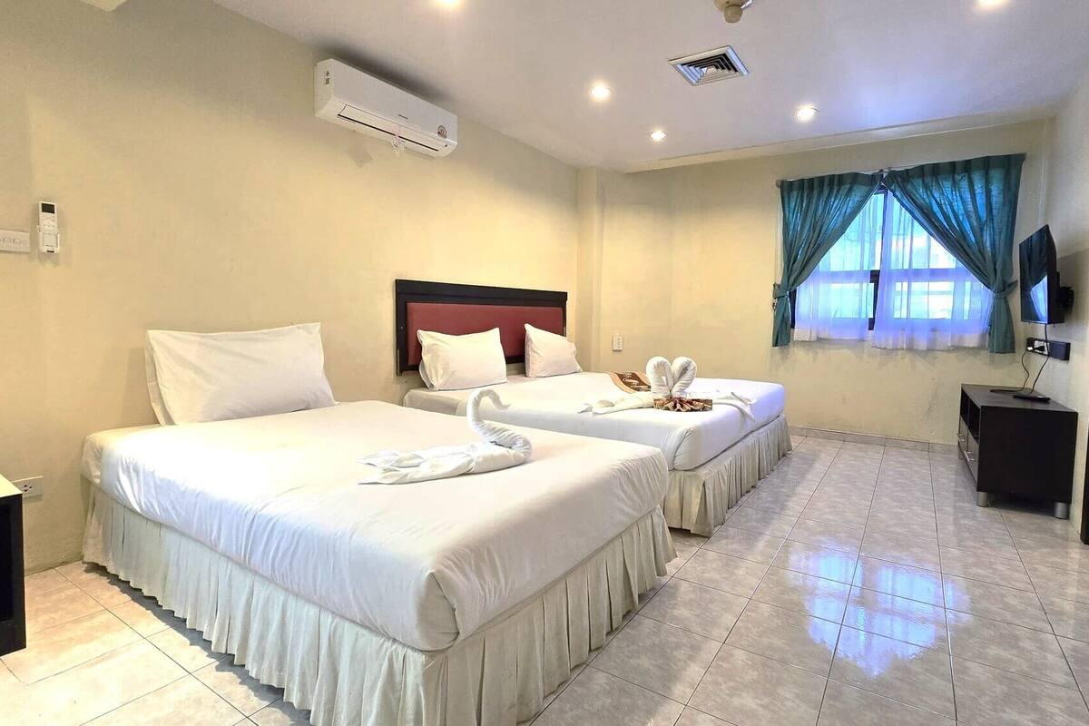 Family Triple Room | Minibar, in-room safe, individually furnished, desk