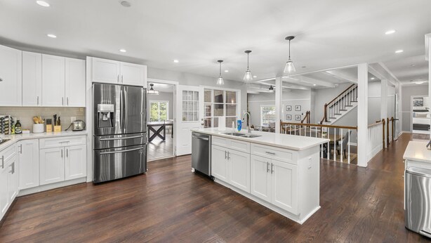 A spacious kitchen with white cabinets, stainless steel appliances, and a large island. - Mansion With Private Pool Bsktball Tennis Courts (Fayetteville)