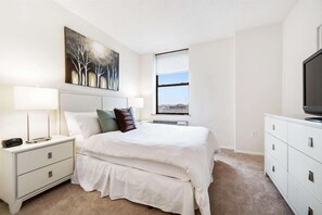 1 bedroom, desk, iron/ironing board, travel crib