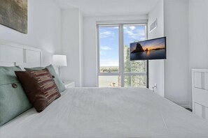 1 bedroom, desk, iron/ironing board, travel crib