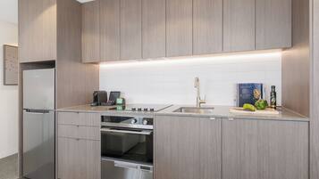 Two Bedroom Apartment | Private kitchen | Full-sized fridge, microwave, dishwasher, espresso maker