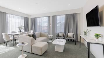 Three Bedroom Apartment - Interconnecting | Living area | 50-inch Smart TV with satellite channels, Netflix, streaming services