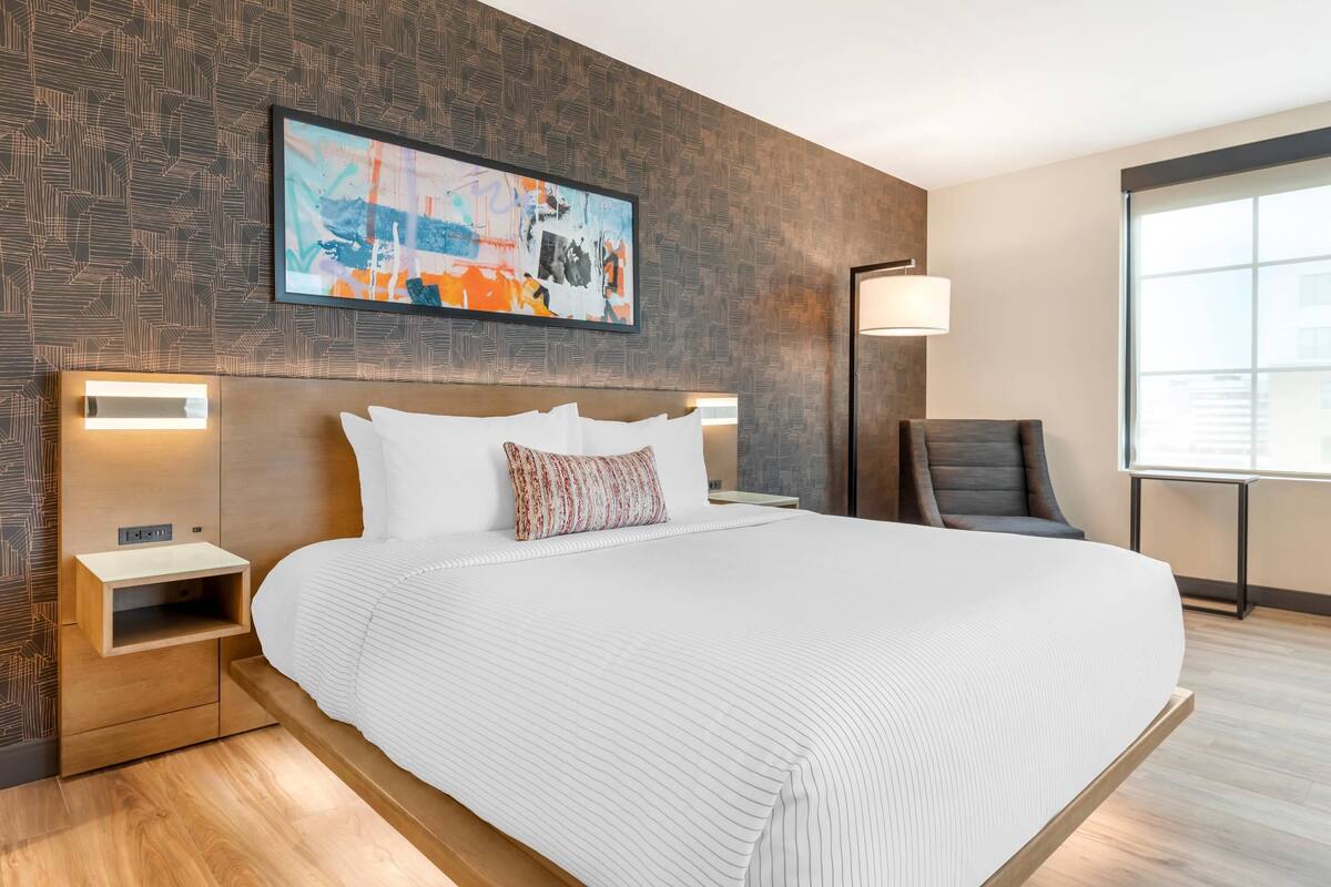 Premium bedding, desk, laptop workspace, blackout curtains