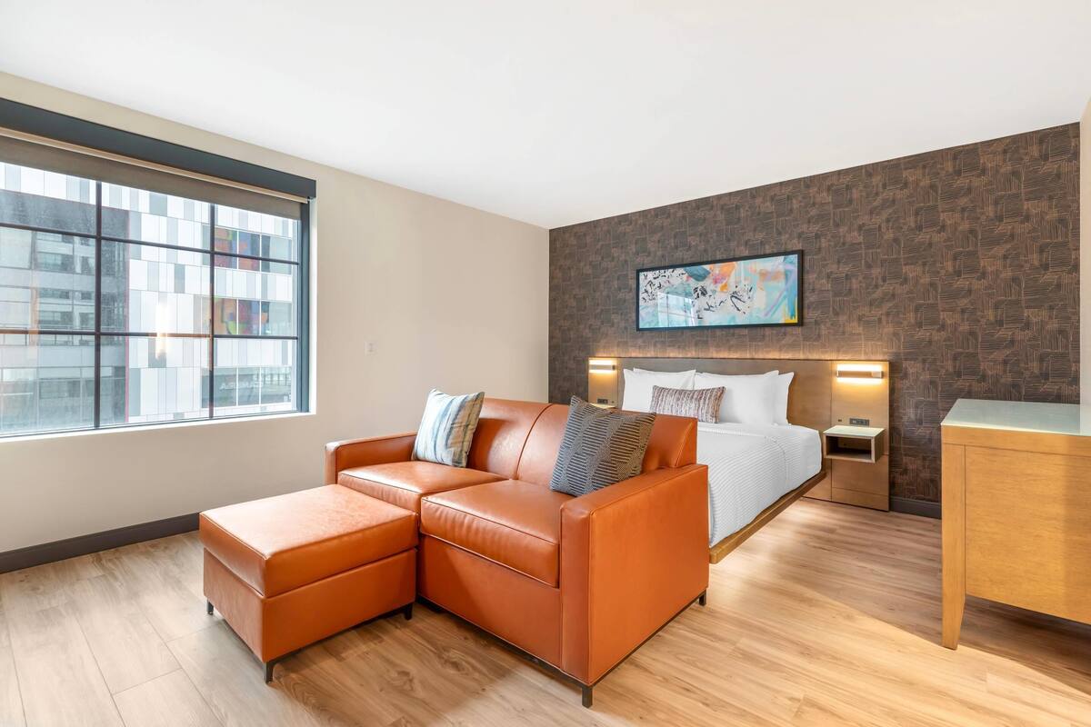 Premium bedding, desk, laptop workspace, blackout curtains