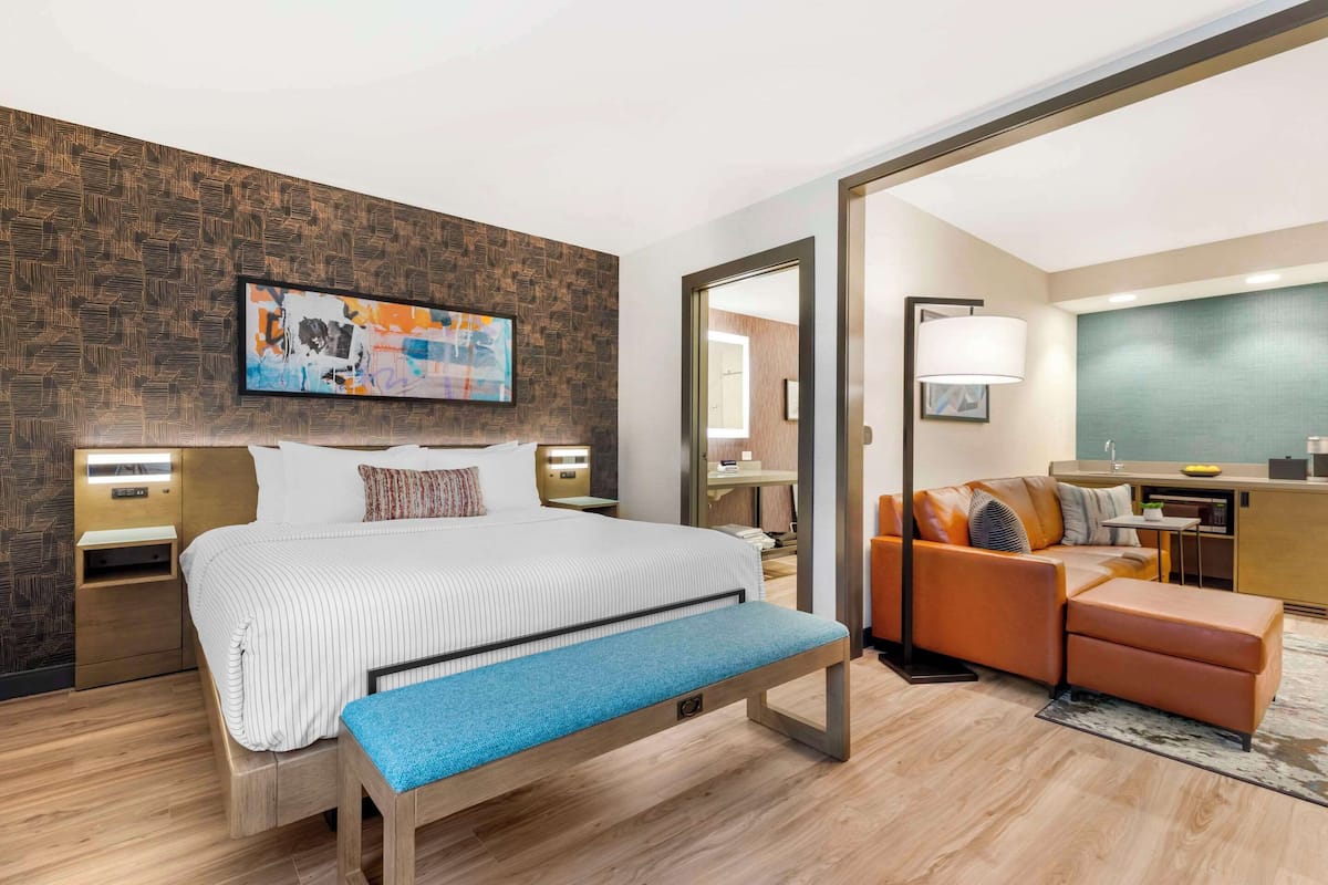 Premium bedding, desk, laptop workspace, blackout drapes