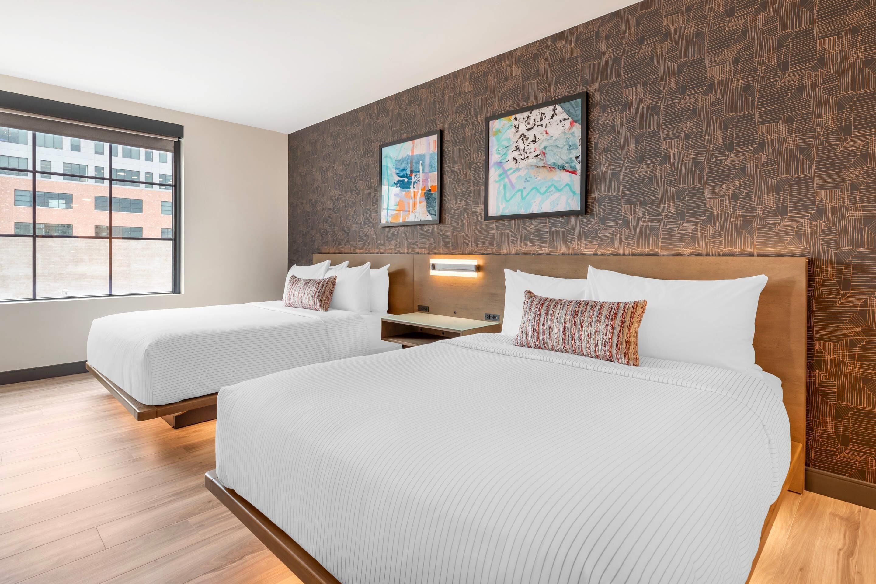 Premium bedding, desk, laptop workspace, blackout drapes