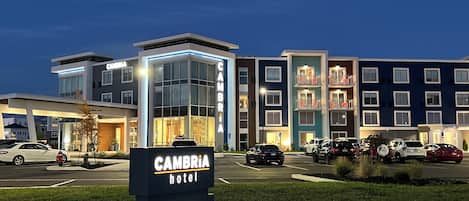 A hotel entrance with a sign reading "CAMBRIA hotel" and "ENTER".