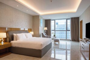 Standaard appartement, 4 slaapkamers | Luxe beddengoed, een minibar, een kluis op de kamer, een bureau