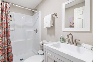 Shower, hair dryer, towels, shampoo