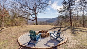 A circular seating area with Adirondack chairs around a fire pit, surrounded by a gravel path and a brick border. - Starlight Vista w/Fire Pit, Grill & Mountain Views (Jasper)
