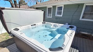 A hot tub with a control panel and a window.