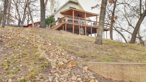 A large, modern house with a spacious deck and a prominent chimney. - Deck + Kayaks: Grand Lake of the Cherokees Home (Afton)