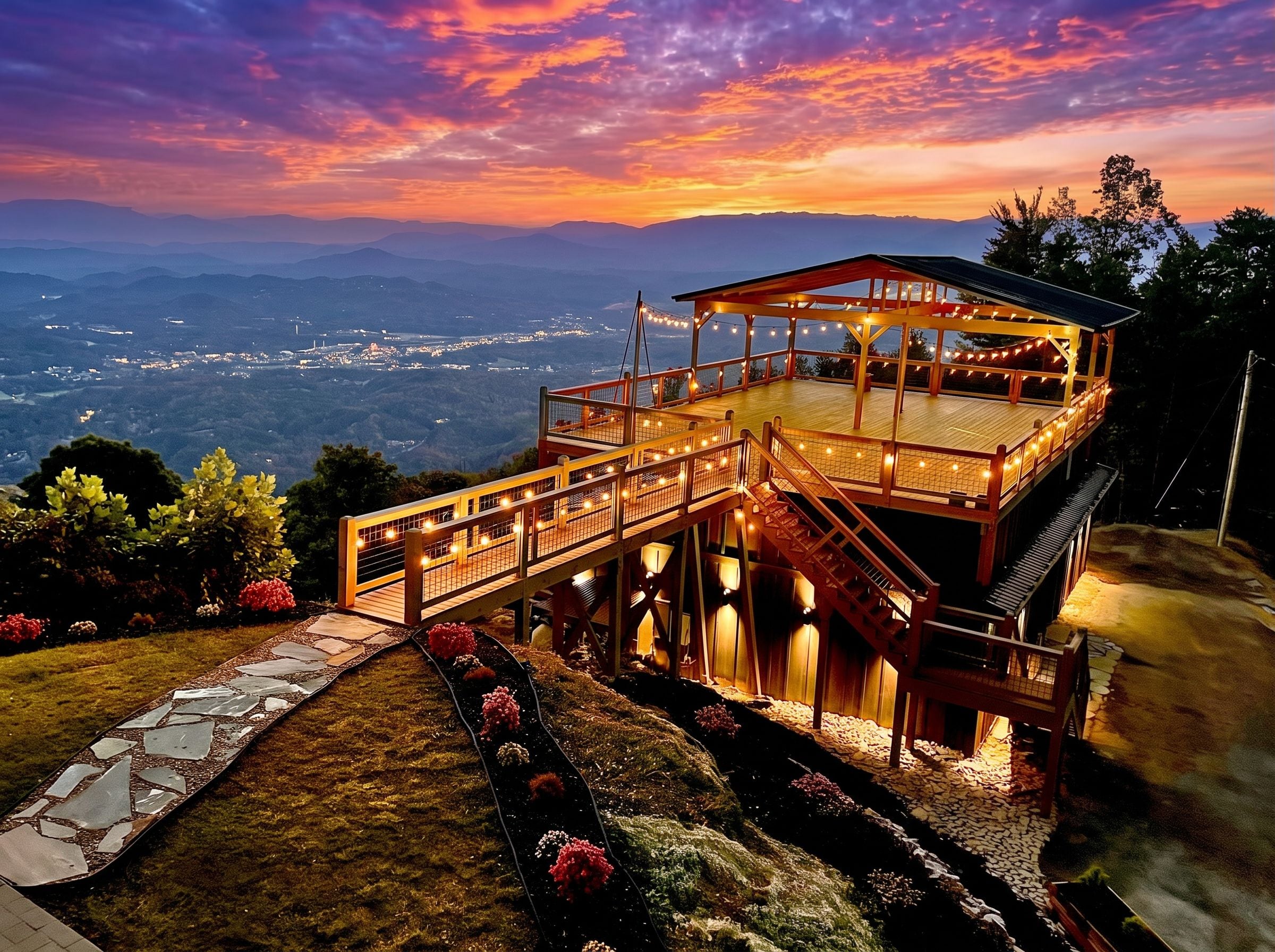 A wooden deck with a glass balustrade overlooking a valley.