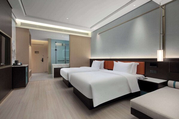 A modern hotel room with two beds, a desk, and a bathroom visible in the background. - Days Hotel BY Wyndham Changsha Kaifu (Changsha)