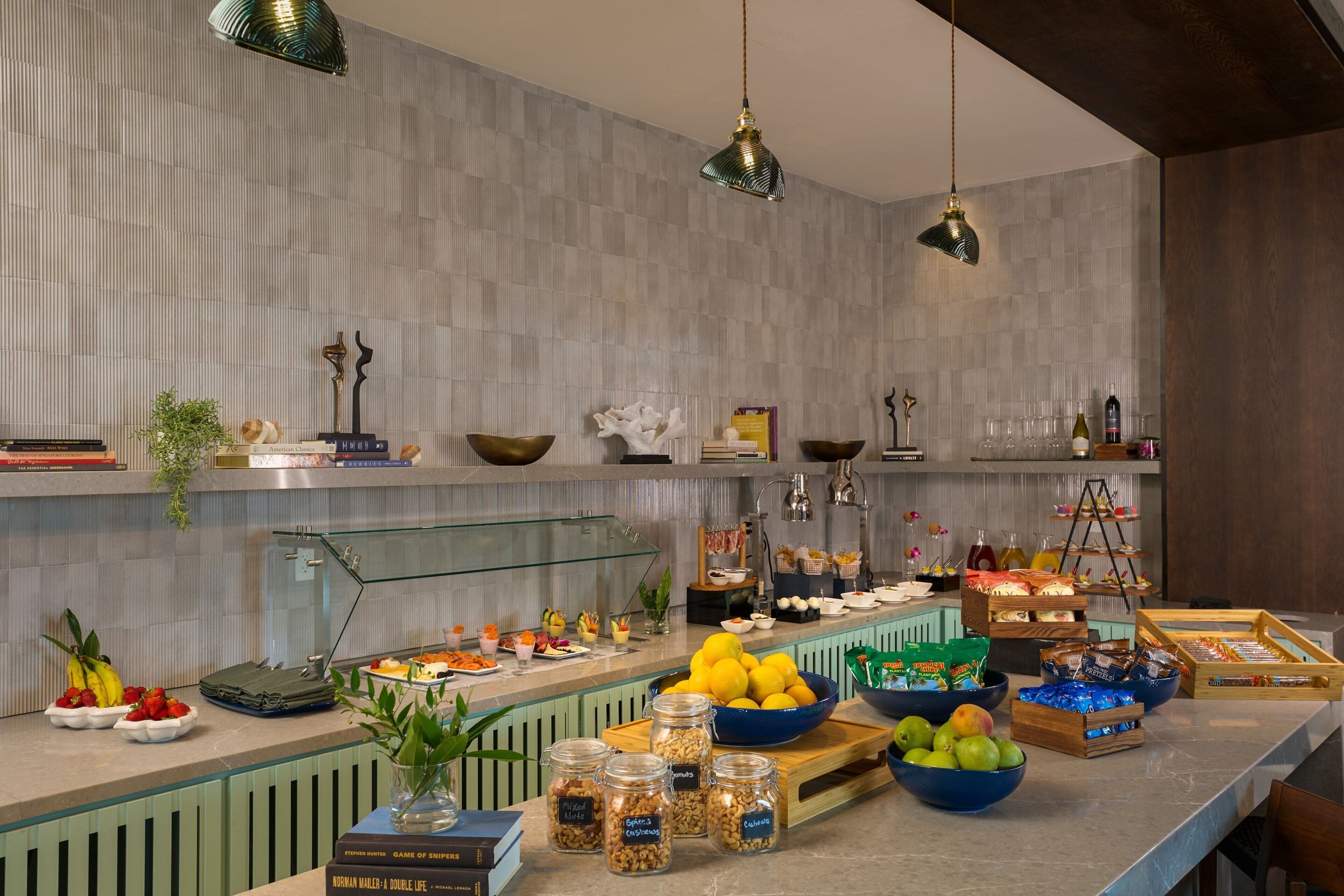 A buffet setup with various food items and condiments.