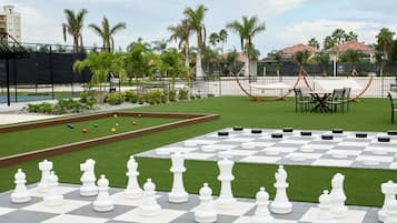 Relax in a spacious outdoor area with a well-maintained lawn, perfect for games and recreation.