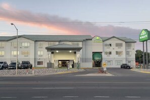 A Wingate by Wyndham hotel with a TEQUILA sign, a DIP parking sign, and a green Wingate sign. - Wingate by Wyndham Farmington NM (Farmington)