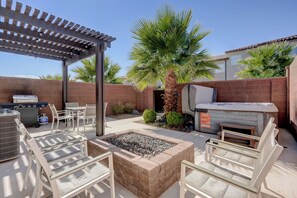 An outdoor patio with a grill, seating, and a pergola. - Top Tier Townhome in Washington Utah Private Spa, Pool, Firepit. VS507 (Washington)