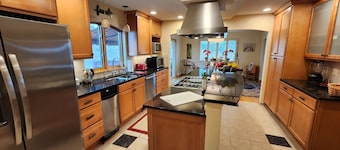 Main floor master, gourmet kitchen, and Hot tub with amazing mountain views