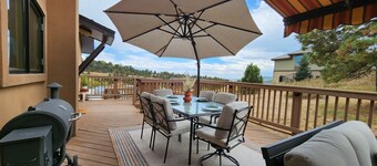 Main floor master, gourmet kitchen, and Hot tub with amazing mountain views