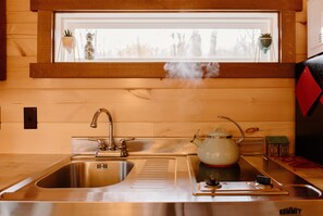 Fridge, stovetop, coffee/tea maker, electric kettle