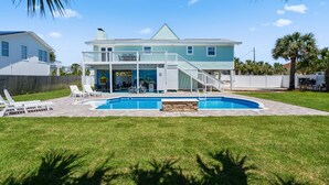 A two-story house with a swimming pool, a covered patio, and a front porch.