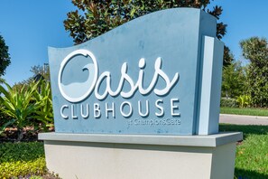 A sign for Oasis Clubhouse at ChampionsGate.