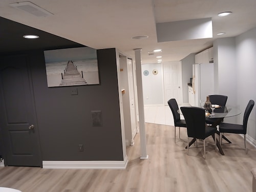 furnished basement studio, with1 queen bed, a kitchenette, and 1 bathroom. 
