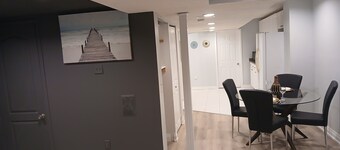 furnished basement studio, with1 queen bed, a kitchenette, and 1 bathroom. 
