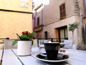 Enjoy a romantic dinner for two in our charming outdoor dining area.