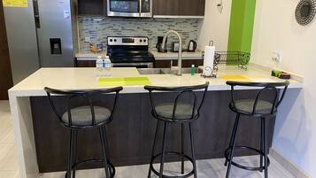 Apartment | Private kitchen | Full-sized fridge, microwave, oven, stovetop