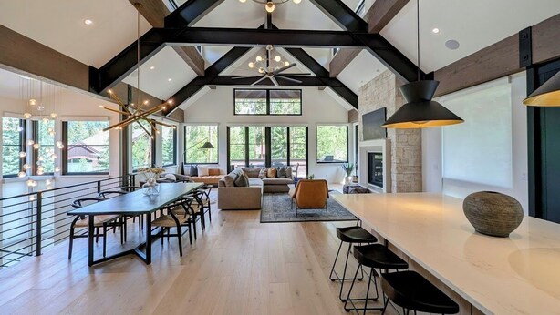 A spacious kitchen with a long counter, dining area, and seating. - Wolf Rock Home 82 (Keystone)