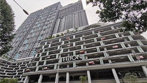 A modern building with balconies and a sign reading "TRIONI by BINASTRA". - Trion Kuala Lumpur by Roam (Kuala Lumpur)