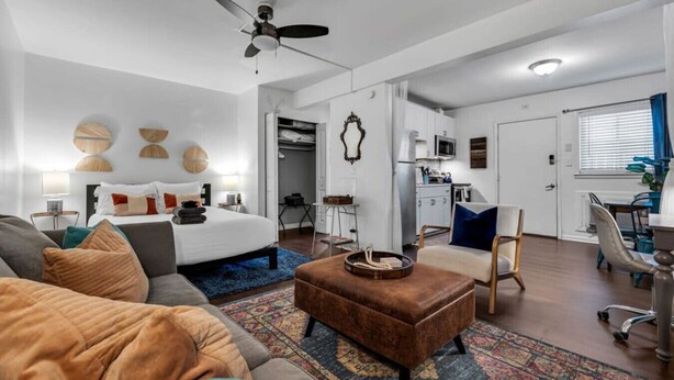 A modern apartment with a living room, bedroom, kitchenette, and a dining area. - Near 12th South | Pool | 3 mi. to Broadway (Nashville)
