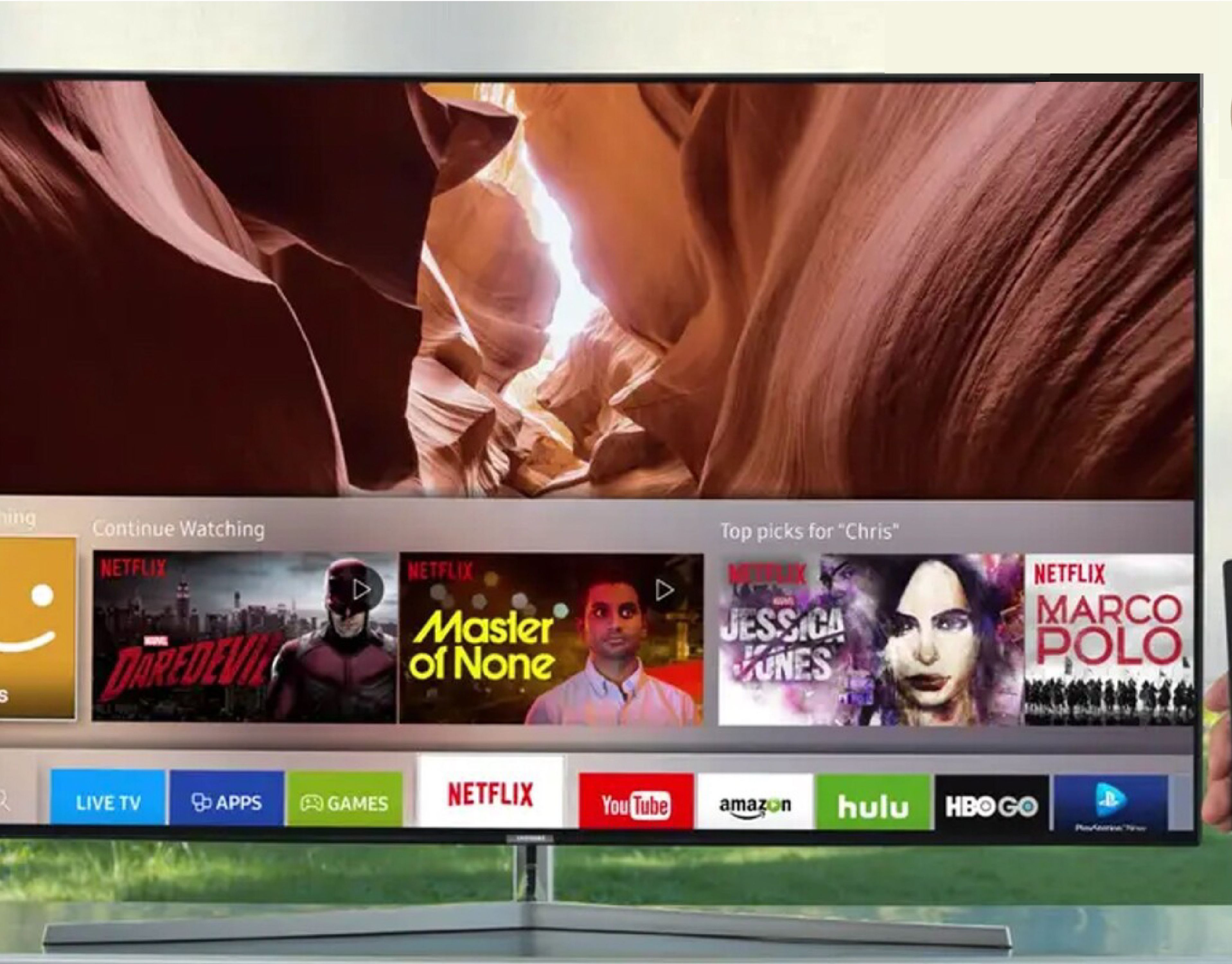 A television displaying a travel-themed interface with a remote control in hand.