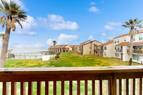 Waterfront condo with bay view, outdoor pool, tennis, dock, balcony, W/D, & AC
