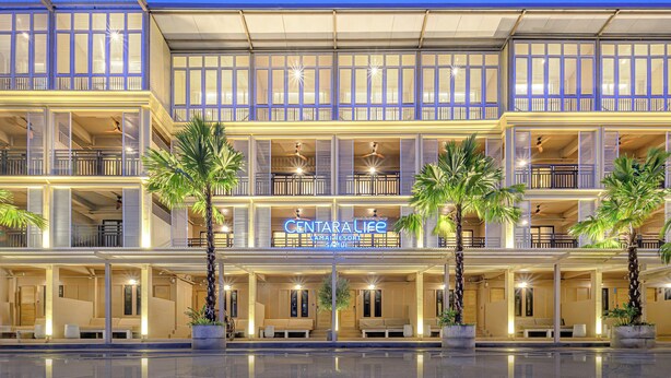 A multi-story hotel with a sign reading "CENTRAL LIFE". - Centara Life Lamai Resort Samui (Koh Samui)