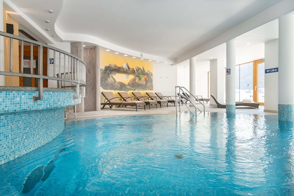 Indoor pool, outdoor pool, open 9:00 AM to 8:00 PM, pool umbrellas