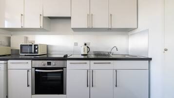 Apartment | Private kitchen | Full-size fridge, microwave, stovetop, dishwasher