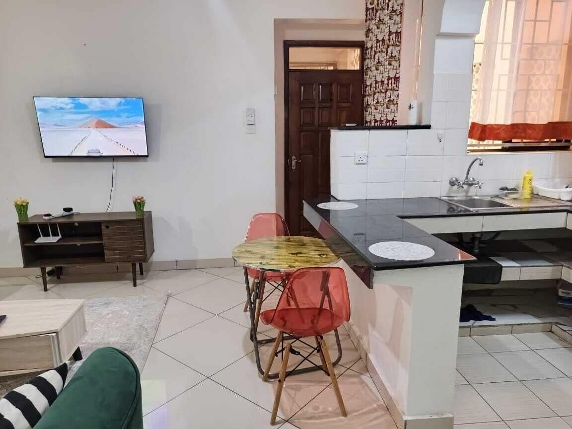 Apartamento empresarial | Área de estar | Smart TV 24 polegadas com canais digitais