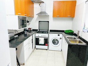 Apartment | Private kitchen | Fridge, microwave, oven, stovetop