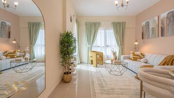 Elite Apartment | Living area | 55-inch Smart TV with cable channels