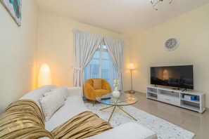 Apartamento luxo | Área de estar | Smart TV 55 polegadas com canais a cabo