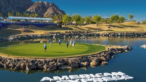 A golf course with a pond and the text 'AMERICAN EXPRESS' on the water.