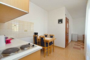 Fridge, stovetop, cookware/dishes/utensils