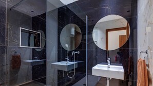 A modern bathroom with two sinks, a shower, and a large mirror. - Yellow 10: Studio Apartment in St. Julian's (Swieqi)