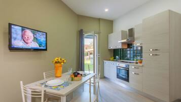 Family Apartment, 1 Bedroom, Sea Facing (Casa Smeralda a 200m From The Sea) | Private kitchen | Fridge, oven, stovetop, cookware/dishes/utensils