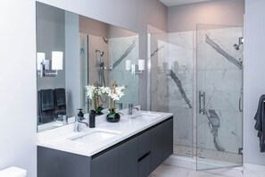 Shower, hair dryer, towels, shampoo