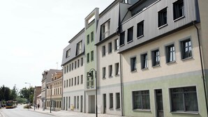 A row of modern multi-story buildings with a consistent architectural style, featuring balconies and large windows. - Cozy studio in charming Wrocław with WiFi access (Wrocław)